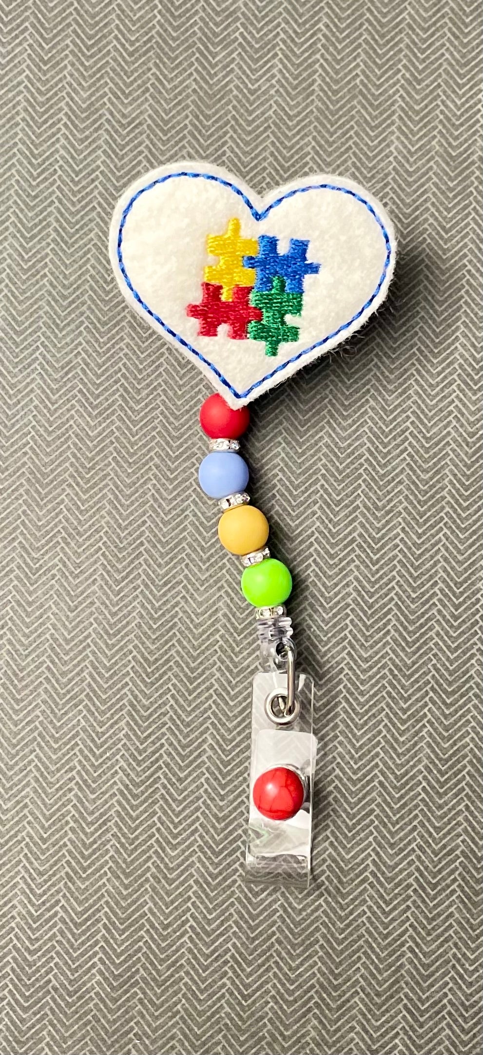 Autism Awareness - Red Bead Badge